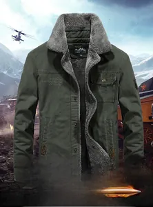 Detail of army green canvas outdoor jacket with thick grey sherpa fleece lining and collar