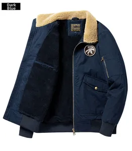 Detail of navy blue flight jacket featuring thick sherpa collar and ribbed windproof cuffs