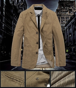 Detail of khaki cotton blazer with patch pockets and contrast striped lining