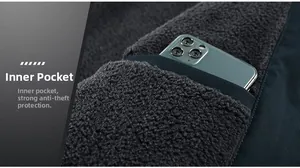 Detail of winter jacket inner fleece lining featuring a secure anti-theft phone pocket