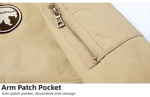 Detail of khaki jacket sleeve with a zippered utility pocket and circular embroidered patch