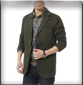 Detail of army green cotton blazer featuring front flap pockets and a notched lapel design
