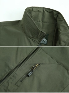 Macro view of army green fishing vest featuring stand collar and sports zipper details