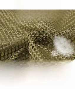Close-up of breathable honeycomb mesh lining in army green outdoor fishing vest