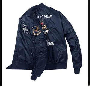 Detailed view of the ribbed stand collar and military embroidery on this navy bomber jacket