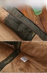 Detail view of winter jacket with thick brown fleece lining and metal zipper closure