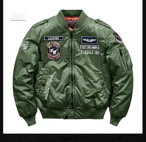 Detail of military green bomber jacket with vintage flight patches and ribbed collar