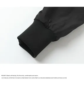 Close-up of black bomber jacket elastic ribbed cuffs with windproof stitching detail