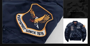 Close-up of military-style eagle embroidery on navy blue quilted flight jacket
