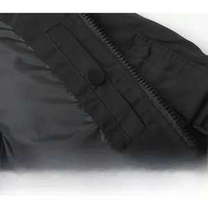 Detail view of water-resistant fabric with zipper and snap button on flight jacket