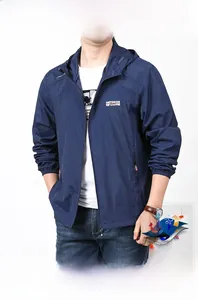 Detail of navy blue sun protection jacket showing zip pockets and hooded drawstring cord