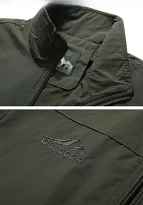 Detail of army green outdoor vest showing stand collar and outdoor mountain embroidery