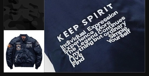 Detailed embroidery patches and Keep Spirit text on dark blue bomber jacket