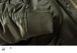 Detailed close-up of the ribbed knit cuffs on a military green MA-1 flight jacket
