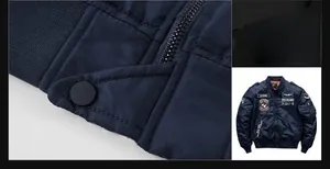 Close-up of navy bomber jacket featuring durable metal zippers and military-style studs
