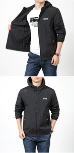Detail of men's black hooded sun protection jacket with outdoor adventure logo print