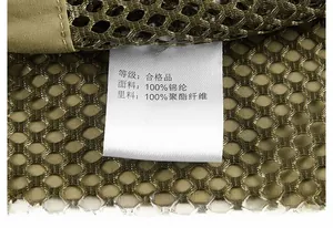 Detail shot of care label on outdoor vest made of 100% nylon and mesh fabric