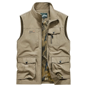 Close-up of khaki outdoor vest showing functional pockets and camo mesh lining details