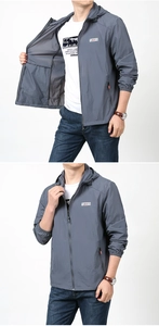 Detail of grey sun protection hoodie showing hooded drawstring and outdoor chest logo