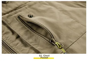 Detail of khaki outdoor vest showing chest pocket with zipper and green pull cord
