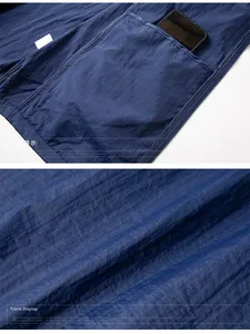 Detail of navy blue sun protection jacket showing functional inner pocket and fabric texture