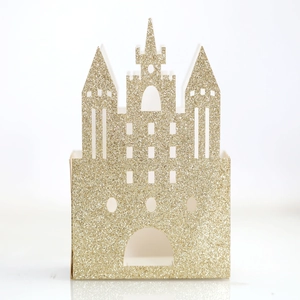 Glittery gold castle candy box with intricate hollow cutouts for wedding favor packaging