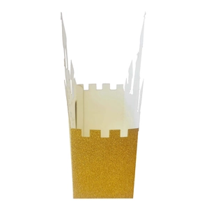 Detail of golden glitter castle candy box featuring hollow paper cutout architecture