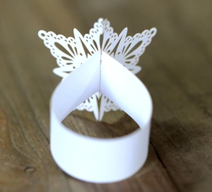 Elegant white laser-cut butterfly napkin ring for Christmas dinner table decoration