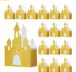 Detail of glittery gold castle candy box with intricate cutouts for party favors
