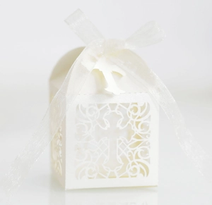 Detailed laser-cut white wedding gift box with cross pattern and elegant ribbon bow
