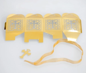 DIY kit detail showing hollow cross paper gift box template with ribbon and charm