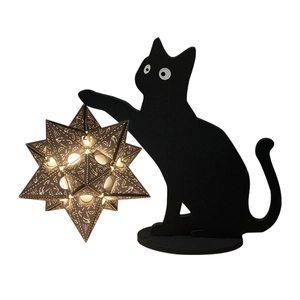 Creative black cat silhouette lamp with a glowing hollow star-shaped warm light lampshade