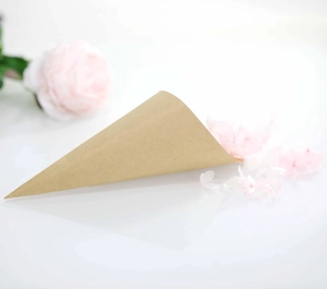 Macro detail of kraft paper wedding petal cones with natural texture and rose petals