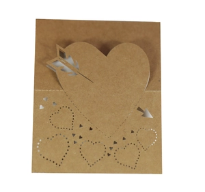 Laser-cut kraft paper wedding place card with cupid arrow and heart design on white background