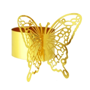 Close-up of golden hollow butterfly napkin ring with laser-cut wing texture details