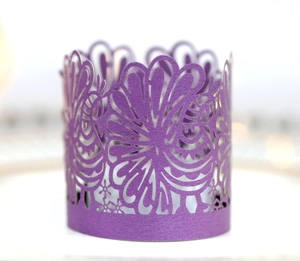 Macro shot of purple laser-cut pearl paper lace wrap for LED tea light candles