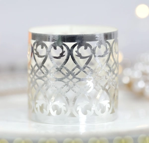 Silver laser-cut hollow tea light candle shade with elegant European scroll patterns
