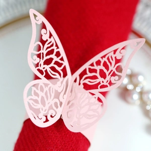 Pink laser-cut butterfly napkin ring made of pearlescent paper for wedding table decor