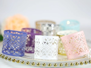 Detailed laser-cut vine patterns on colorful paper napkin rings for elegant dining decor