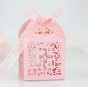 Pink laser-cut candy box with cross hollow pattern and ribbon for wedding favors