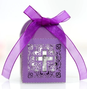 Detailed laser-cut purple candy box featuring cross motifs and organza ribbon bow