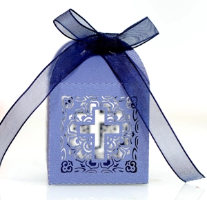 Detailed laser-cut blue wedding favor box with cross design and satin ribbon bow