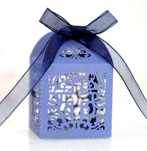 Laser-cut lavender pearl paper candy box with cross motif and blue organza ribbon
