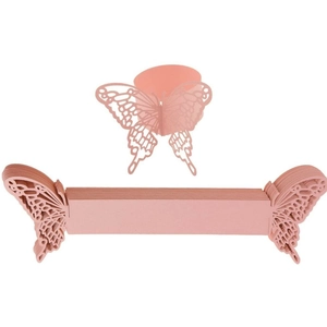Macro detail of laser-cut pink butterfly napkin rings showing folded and stacked cards