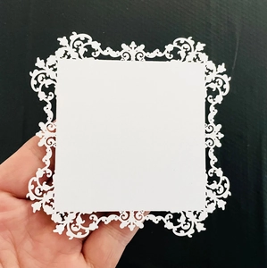 Lace hollow nail display card with intricate white laser-cut floral paper borders
