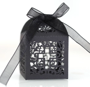 Hollow black cross wedding gift box with intricate laser-cut patterns and ribbon