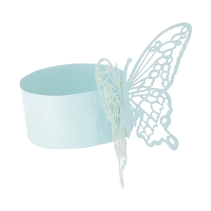 Macro detail of laser-cut light blue butterfly napkin ring with intricate hollow wings