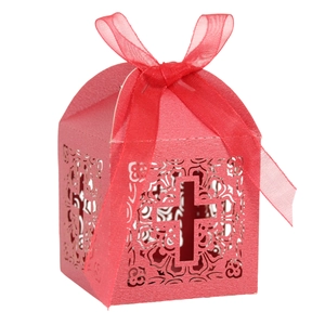 Macro shot of red laser-cut candy box with cross pattern and silk ribbon detail