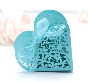European laser-cut heart candy box in Tiffany blue with elegant ribbon bow for weddings