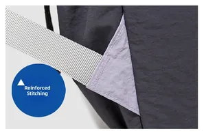 Detail view of reinforced bartack stitching on the purple and grey outdoor backpack